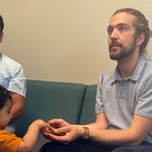 Mason Tuttle with Refugee Family